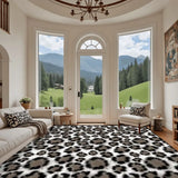 Retro snow leopard print large area rug 9x12 ft in a living room with arched windows and a mountain view