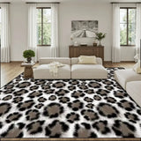 Retro snow leopard print large area rug 9x12 ft in a living room with a cream sofa