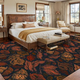 Bedroom with a leather headboard bed above a 9x12 ft rug in rust-brown leaves on near-black