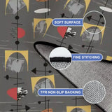 Close-up of gray atomic-pattern rug corner with fine stitching and non-slip backing