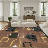 Brown area rug 9x12 ft with black wood-grain patches and geometric shapes in a living room with white sofa