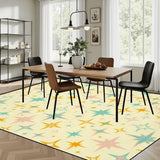 Dining room with a wooden table and chairs on a 9x12 ft area rug, cream with teal, orange and pink starbursts
