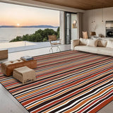 Red black white striped area rug 8x10 ft in an open living room with a sea view through large windows