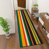 Retro striped hallway runner rug in green and yellow in a hallway with a potted plant