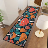 Mushroom pattern hallway runner rug in teal and orange seen from above beside a white table lamp on a wood floor