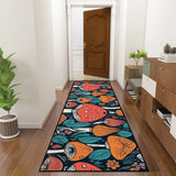 Mushroom pattern hallway runner rug in teal and orange in a hallway leading to a wooden door, with a console and plant