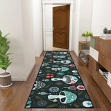 Dark mushroom pattern hallway runner rug in teal tones in a hallway leading to a wooden door, with a console and plant