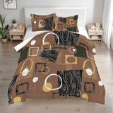 Queen comforter set with woodgrain, circles and squares in brown, black and cream on a bed with two bedside tables