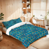Square print comforter set on a bed in a room with wooden shelves and a desk