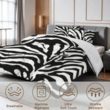 Close view of the zebra print comforter with care icons for breathable and machine washable