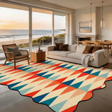 Red and teal triangle-pattern scalloped area rug 9x12 ft in a living room with beach view windows