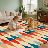 Child and golden retriever on red and teal triangle-pattern scalloped area rug