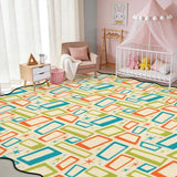 Cream teal and orange rectangle-pattern scalloped area rug in a nursery with crib and pink canopy