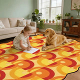 Child and golden retriever on orange and yellow circle-pattern scalloped area rug