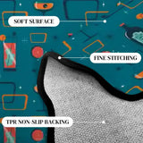 Close-up of teal cocktail-motif scalloped rug corner with black binding and gray non-slip backing