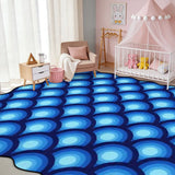 Blue bubble-pattern scalloped area rug in a nursery with crib and pink canopy