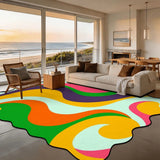 Rainbow swirl scalloped area rug 9x12 ft in a living room with beach view windows