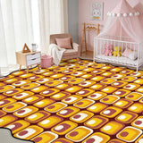 Yellow and brown tile-pattern scalloped area rug in a nursery with crib and pink canopy