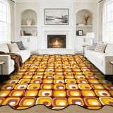 Yellow and brown tile-pattern scalloped area rug in a living room with fireplace and white sofas