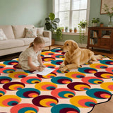 Child and golden retriever on multicolor circle-pattern scalloped area rug