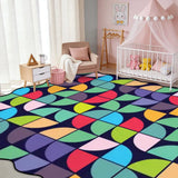 Nursery with a crib and a 9x12 ft colorful geometric scalloped area rug on the floor