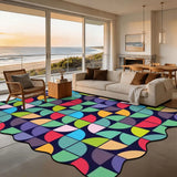 Ocean-view living room with a 9x12 ft scalloped area rug in colorful geometric tiles