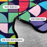 Close-up of the colorful geometric pattern with a lifted scalloped edge showing stitching and backing
