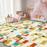 Cream multicolor rectangle-pattern scalloped area rug in a nursery with crib and pink canopy