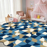 Blue and cream geometric scalloped area rug in a nursery with crib and pink canopy