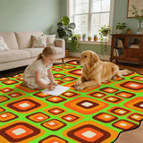 Child and golden retriever on orange and green square-pattern scalloped area rug