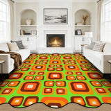 Orange and green square-pattern scalloped area rug in a living room with fireplace and white sofas