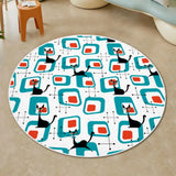 Top view of round rug with white border, teal retro squares, black cats and red-orange accents