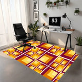 Retro squares rug under a black office chair at a desk in a home office