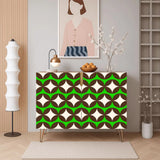 Retro wooden cabinet with brown circles and cream stars on bright green and metal hairpin legs