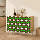 Retro wooden cabinet with brown circles and cream stars on bright green and metal hairpin legs