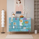 Retro wooden cabinet with hand-drawn daisies and palm leaves on sky blue and metal hairpin legs